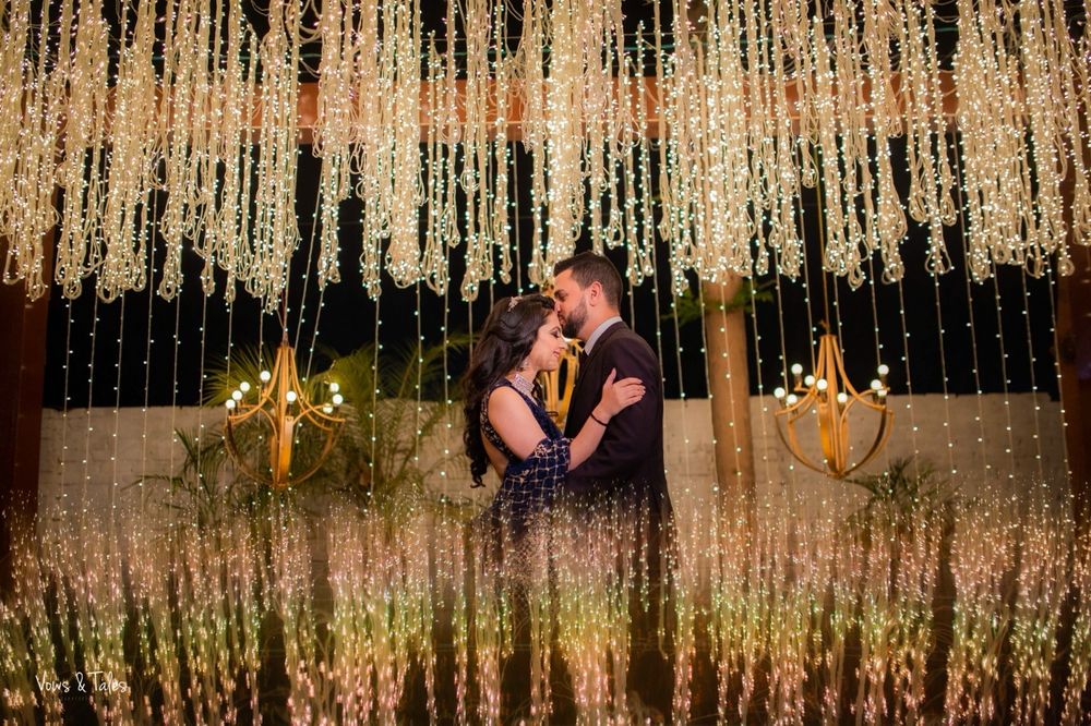 Photo of Couple shot with floral sangeet decor