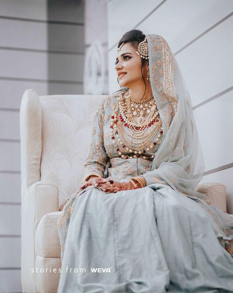 Photo of Pastel muslim bride with layered jewellery