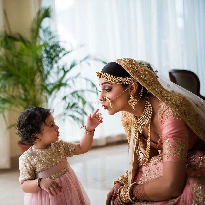 Photo of Cute bridal portrait bride with baby
