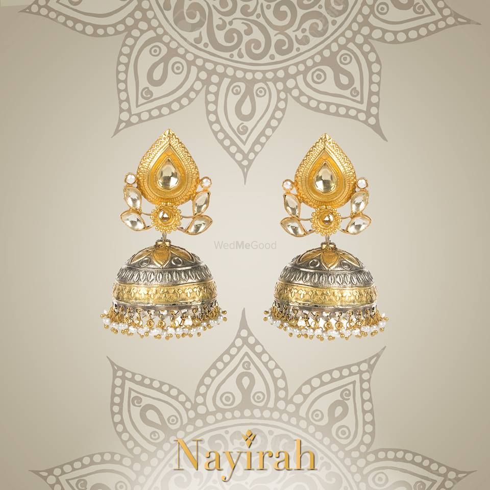 Photo of gold and silver jhumkis