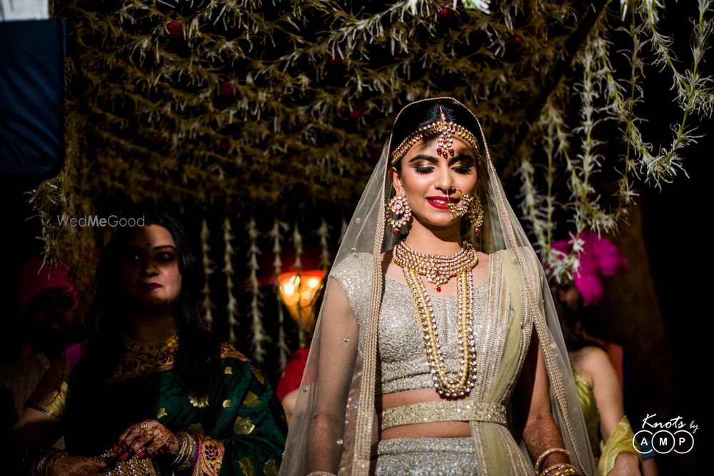 Photo of Shimmery silver bridal lehenga with waist belt