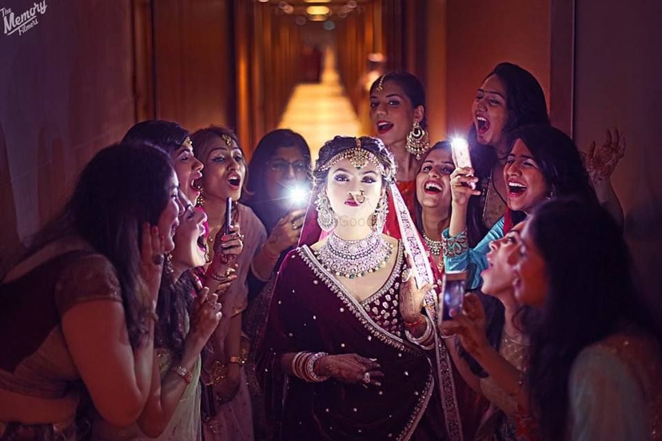 Photo of Fun bridal photo with bridesmaids using phones