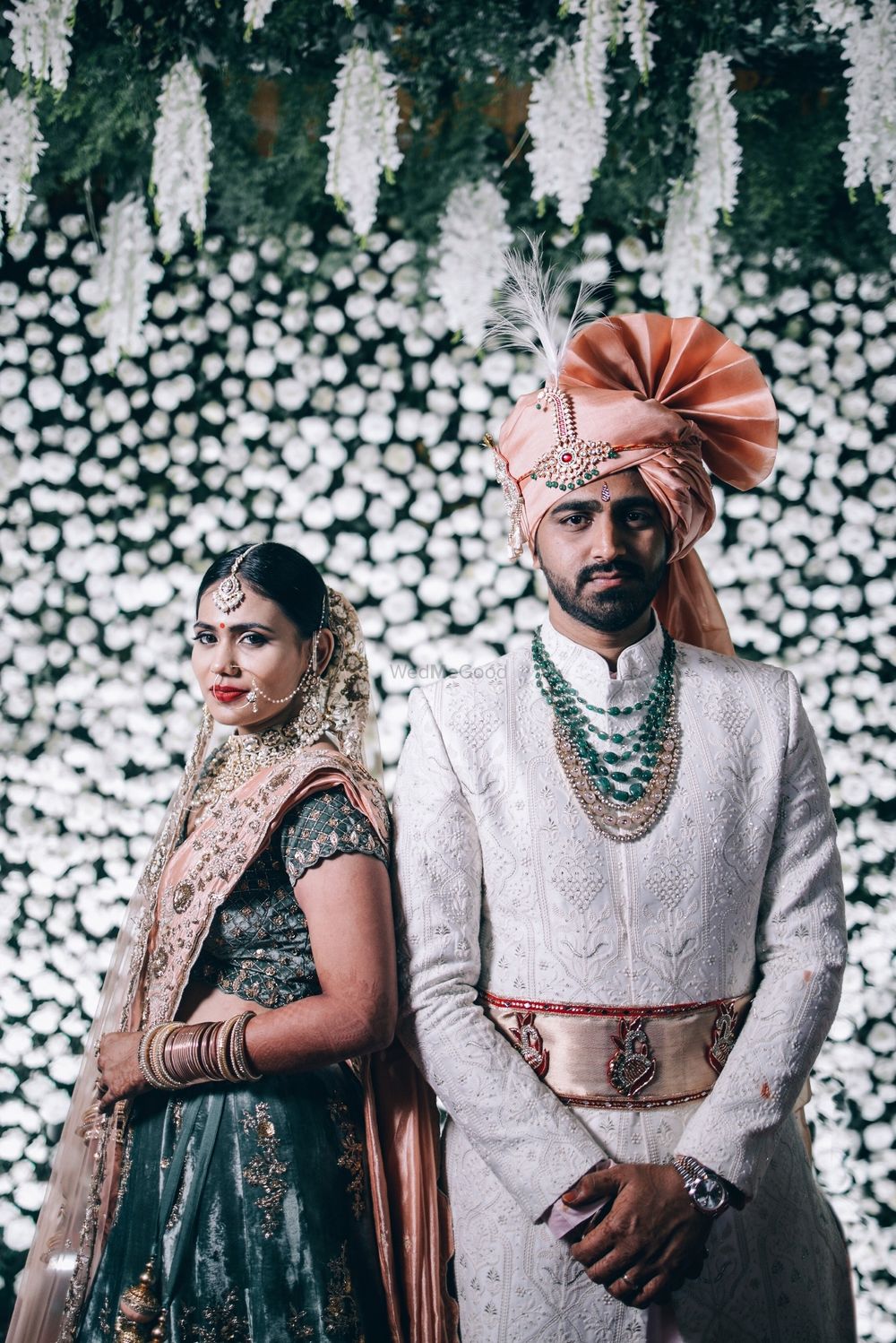 Photo of Modern couple portrait with contrasting bride and groom outfits