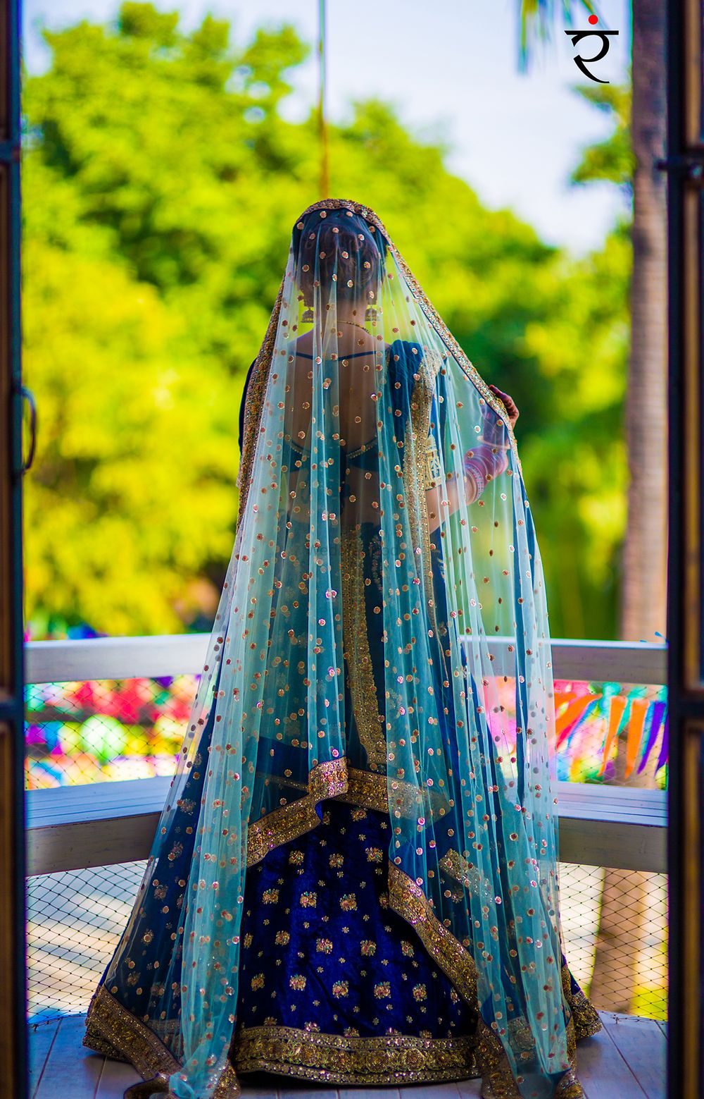 Photo of Offbeat bridal lehenga with dark blue lehenga and light blue dupatta