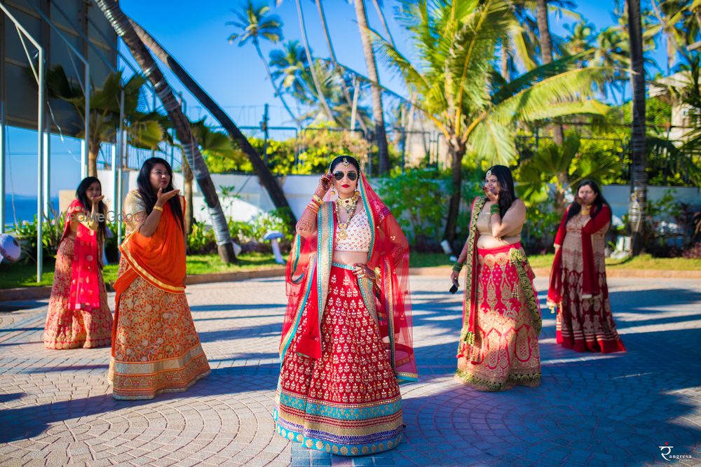 Photo of quirky bride with bridesmaids