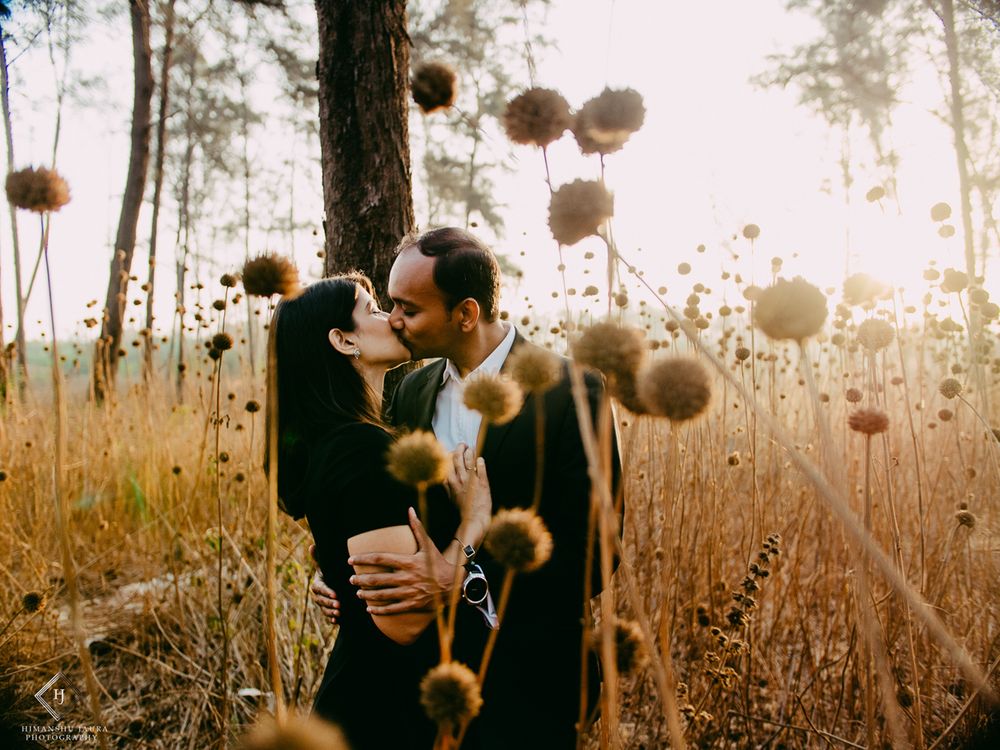 Photo of Couple kissing shot pre wedding shoot