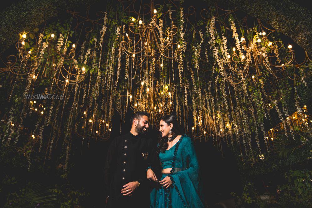 Photo of Bride and groom looking at each other and posing.