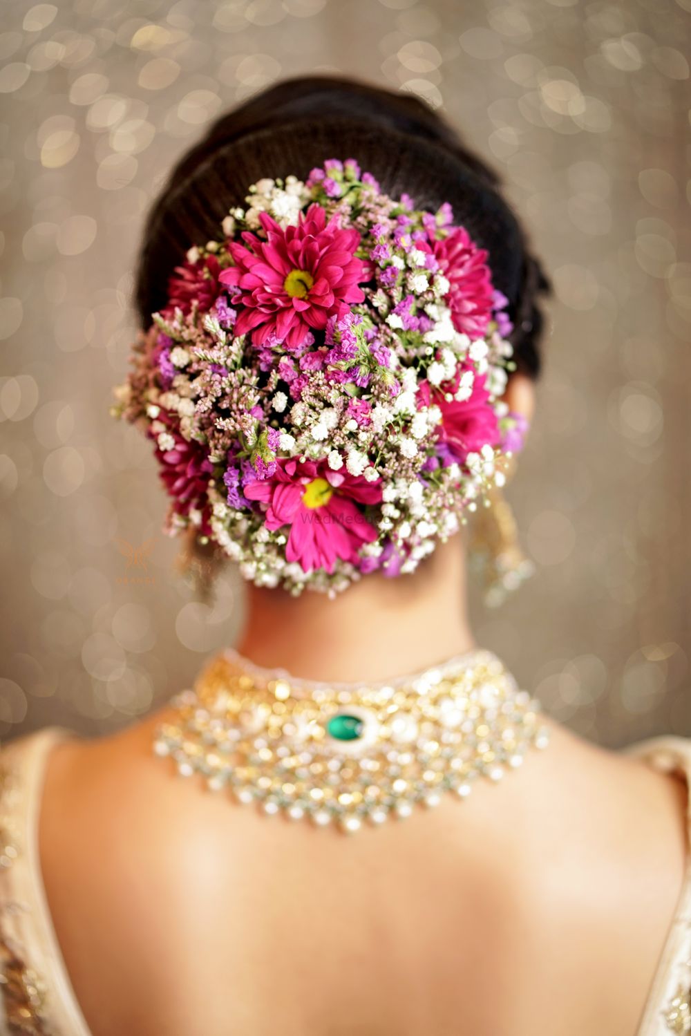 Photo of Unique bridal bun with flowers