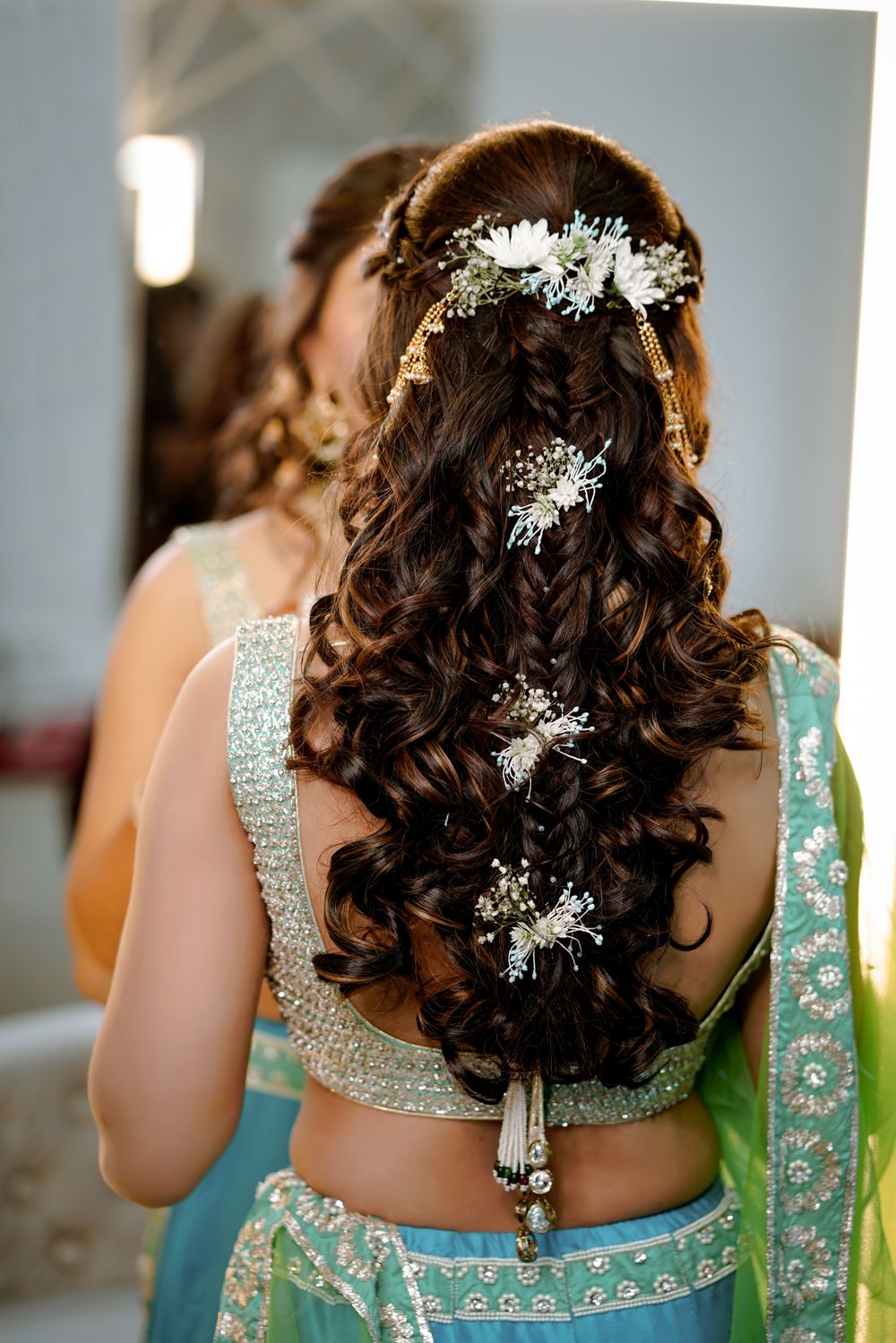 Photo of Open hair style with flower bunches for mehendi