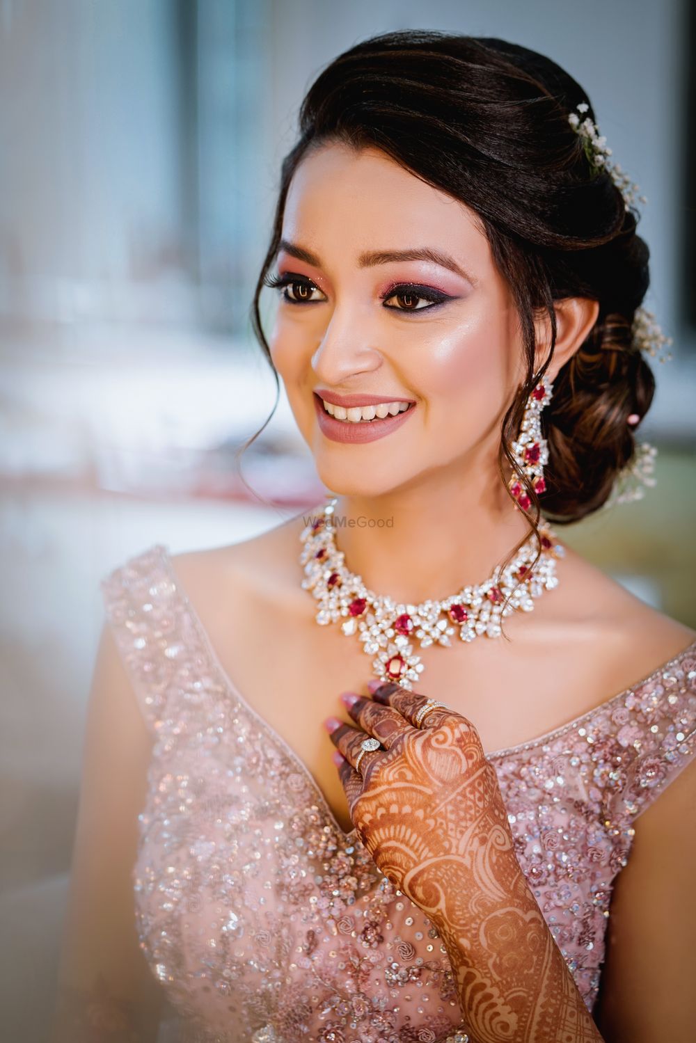 Photo of Glowing makeup with side bun for sangeet