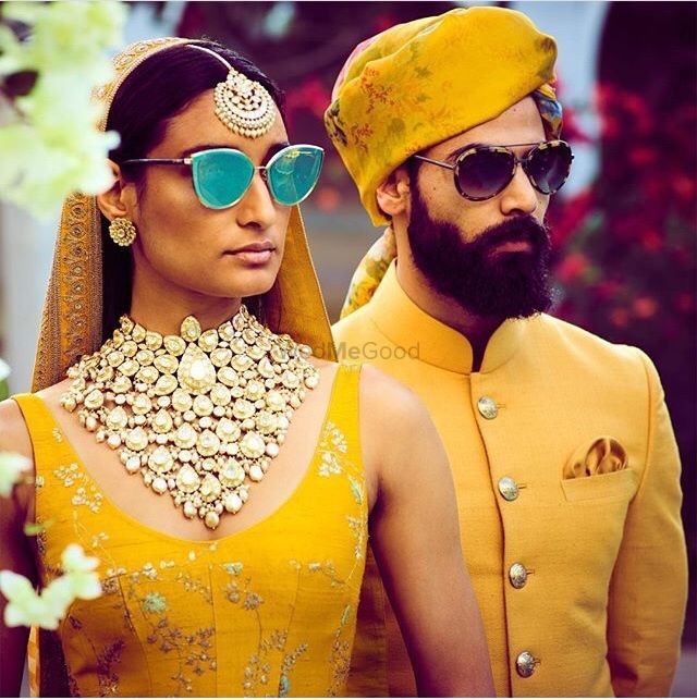 Photo of Matching Sabyasachi looks for bride and groom in yellow