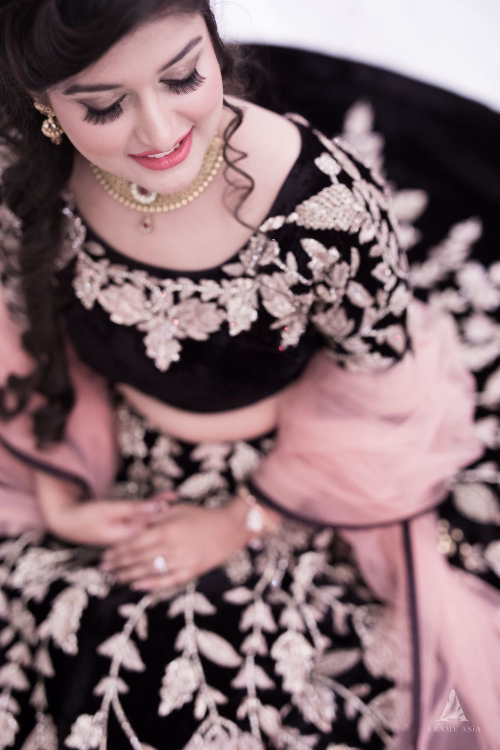 Photo of Black engagement lehenga with pink dupatta