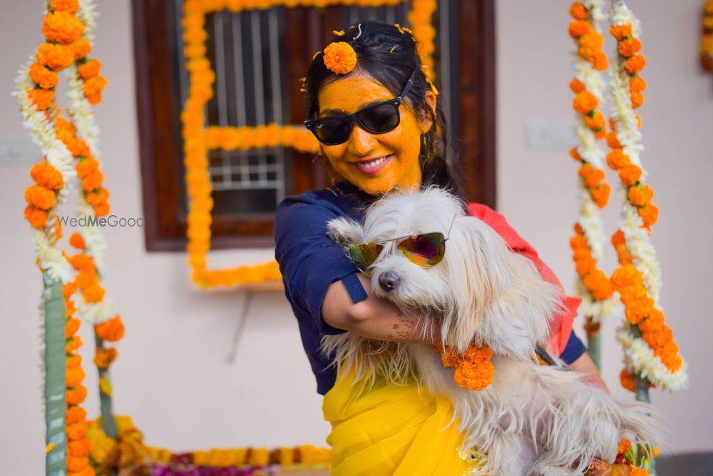 Photo of Bride with dog on haldi