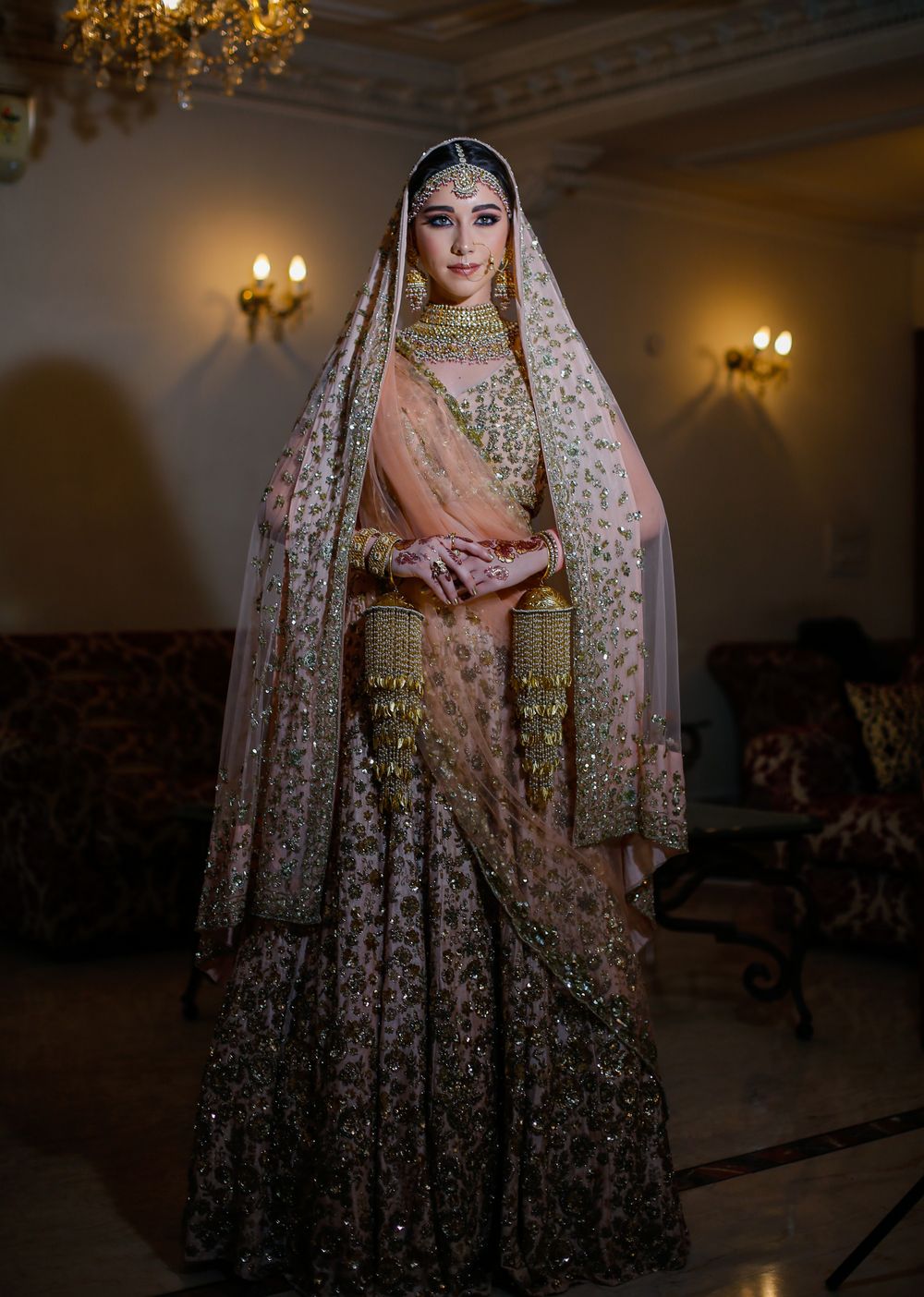 Photo of peach bridal lehenga with sequin work all over