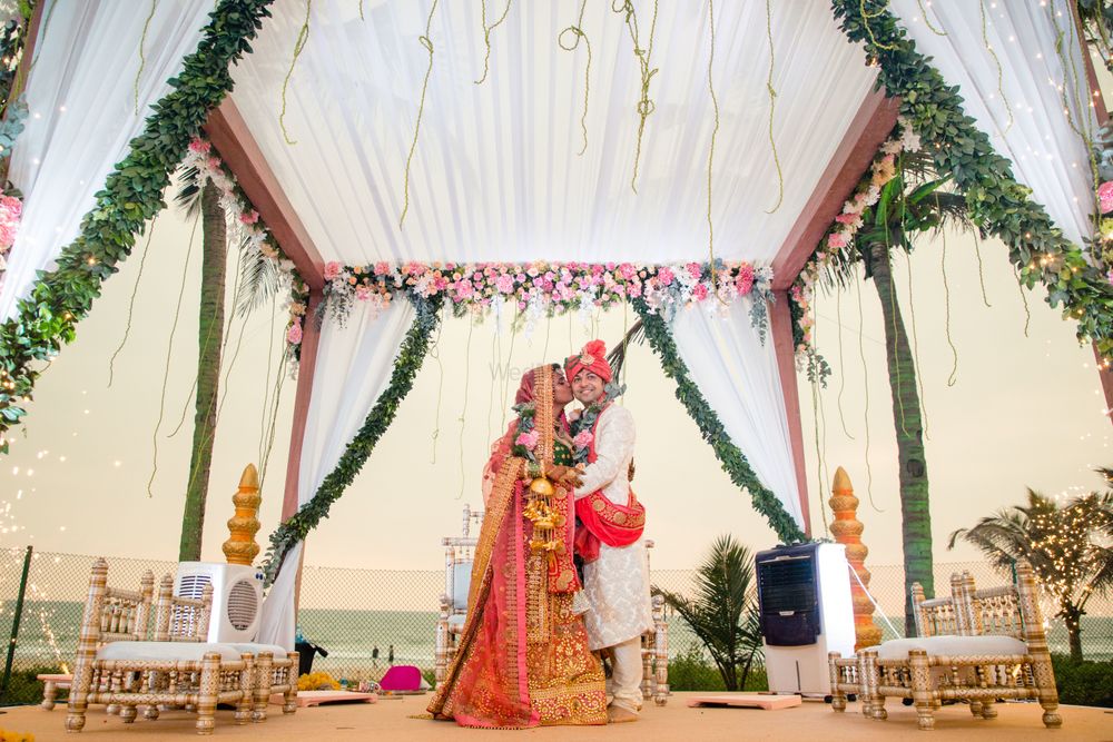 Photo of Simple mandap decor idea with drapes and florals