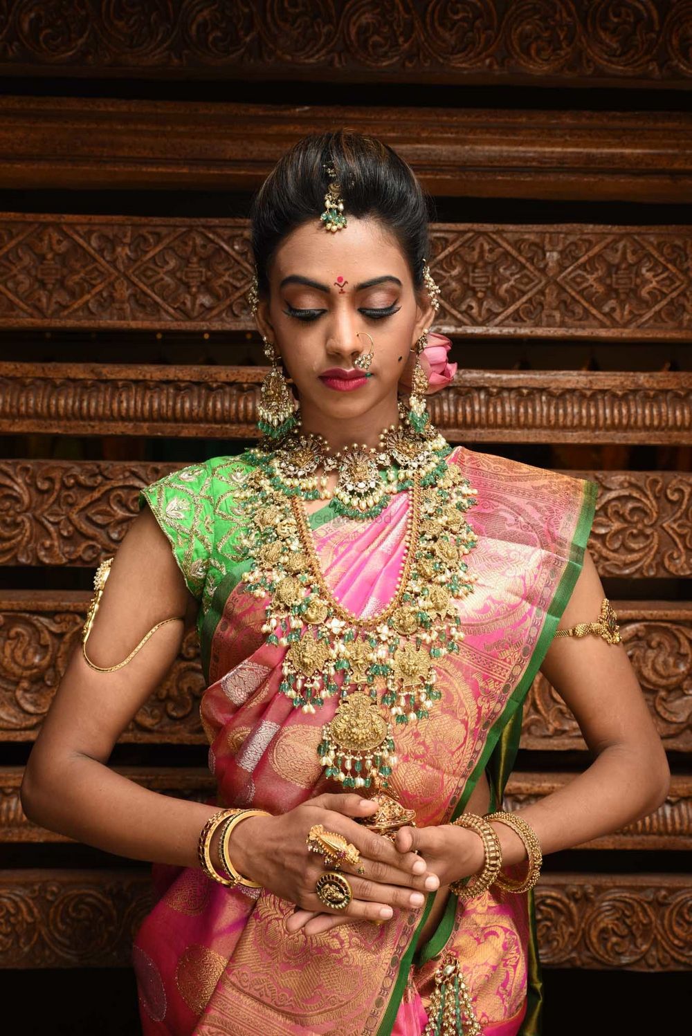 Photo of Stunning south indian bridal necklace with pink and green kanjivaram saree