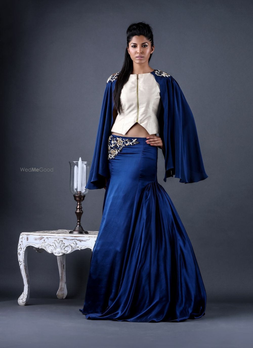 Photo of blue cape lehenga with zip top