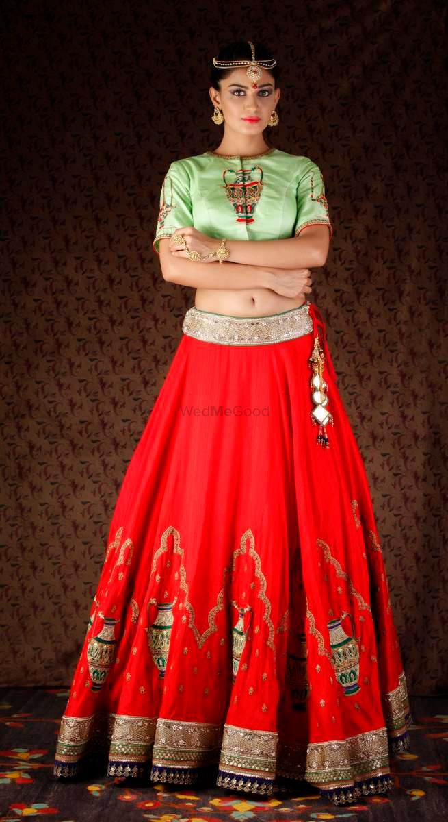 Photo of mint green and red lehenga