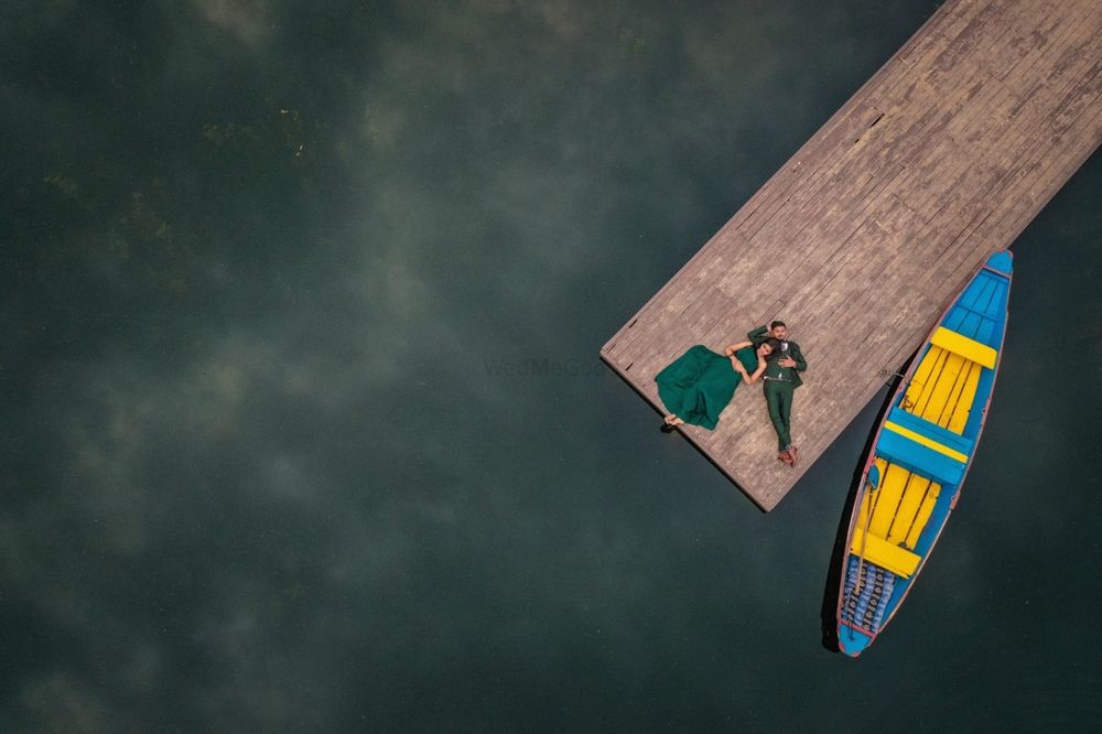 Photo of drone pre wedding shoot photography with boat
