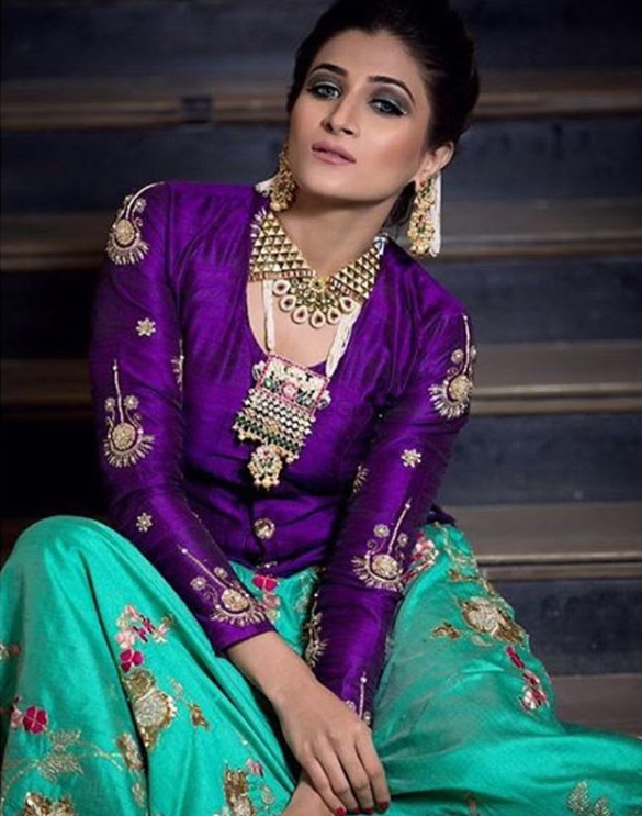 Photo of Pretty purple blouse with turquoise lehenga with jewellery
