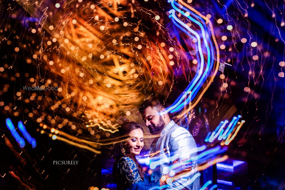 Photo of bokeh couple dancing shot on sangeet