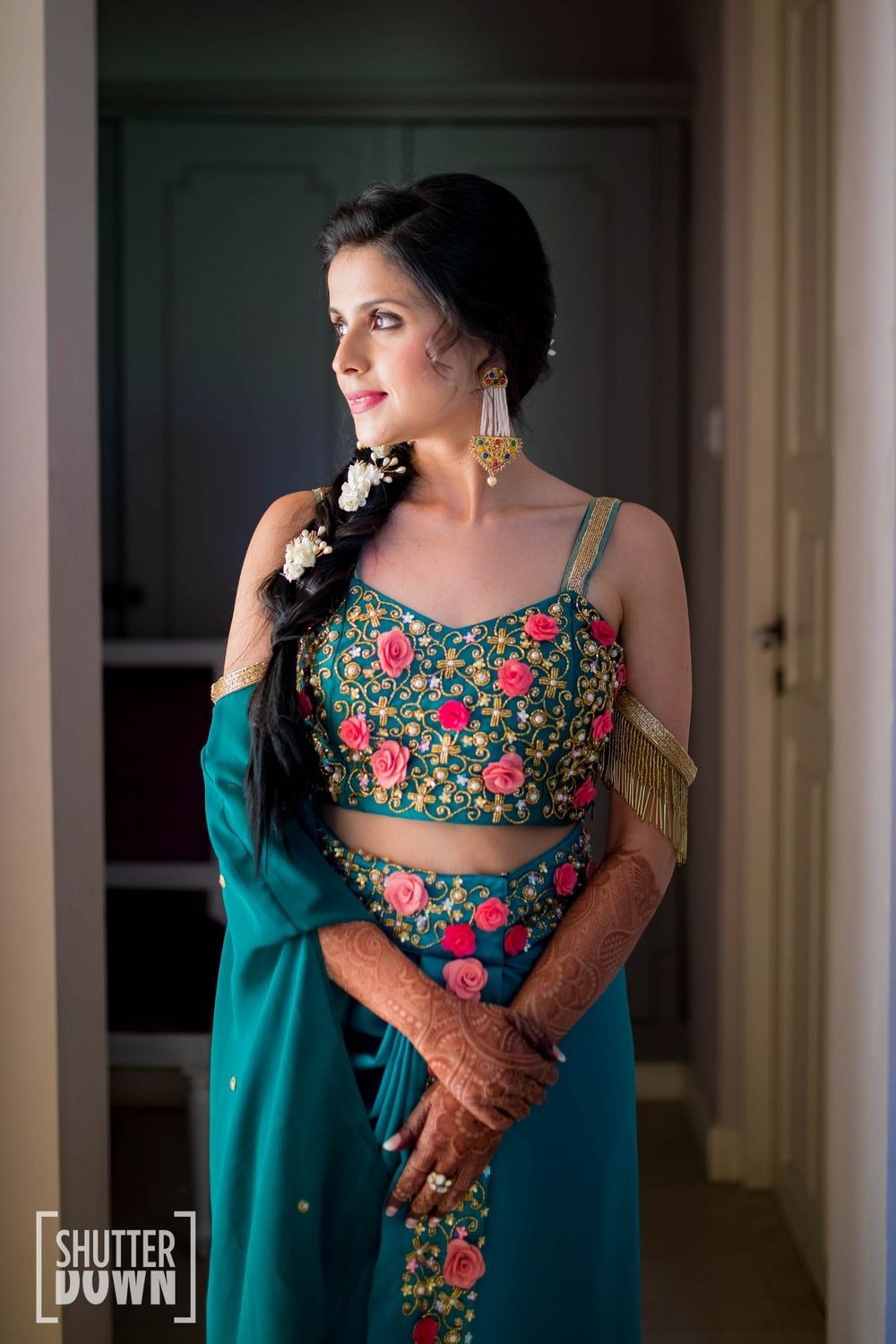 Photo of Teal mehendi outfit with side braid