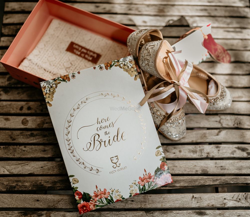Photo of bridal juttis with a cute sign