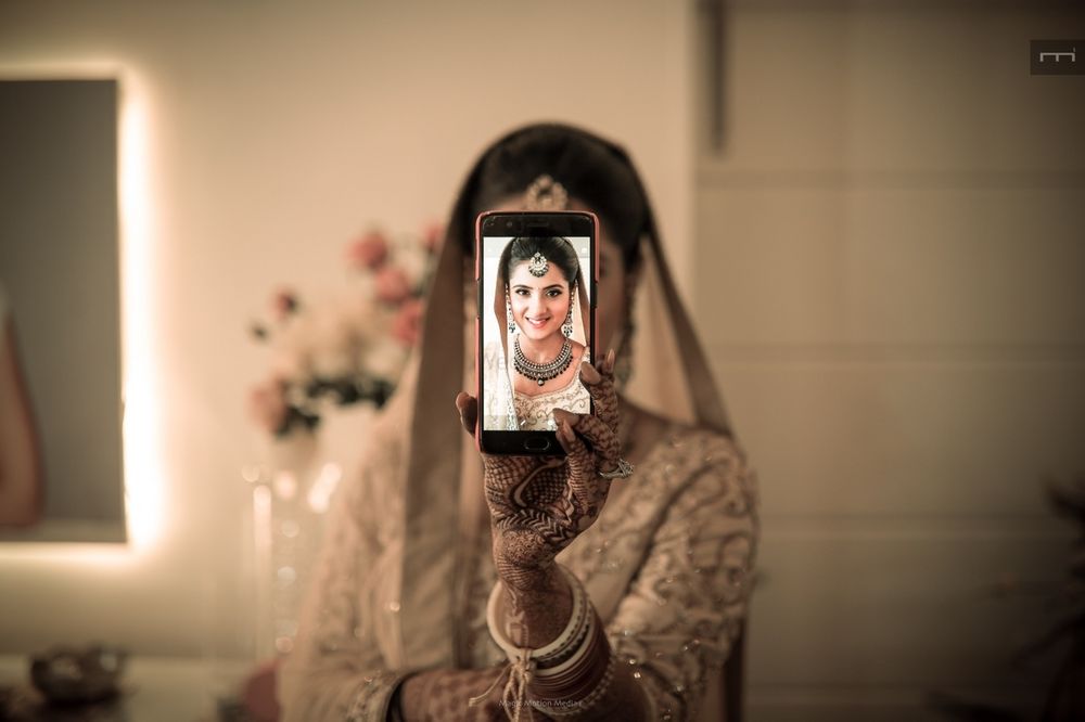 Photo of Unique bridal portrait with phone