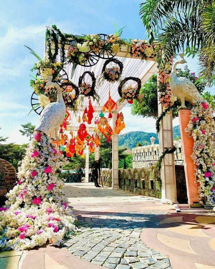 Photo of Grand entrance decor with floral peacocks