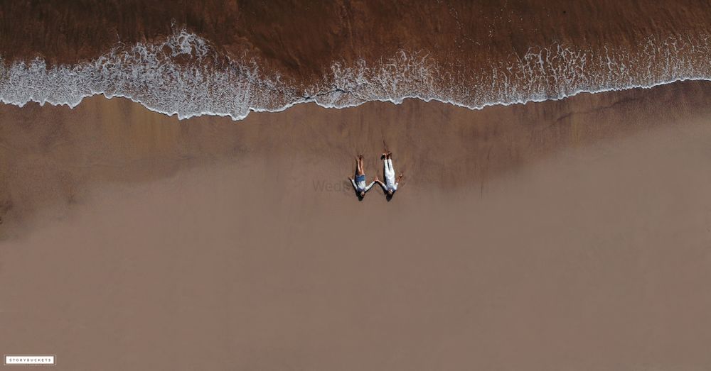 Photo of pre wedding drone photography shot on the beach