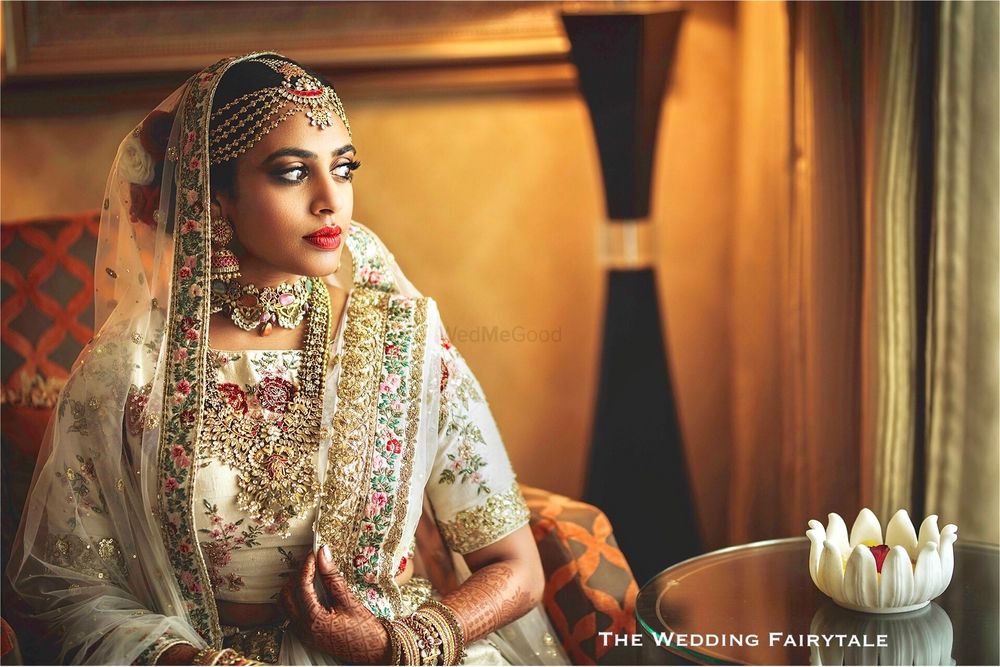Photo of Bride in ivory bridal lehenga with embroidery
