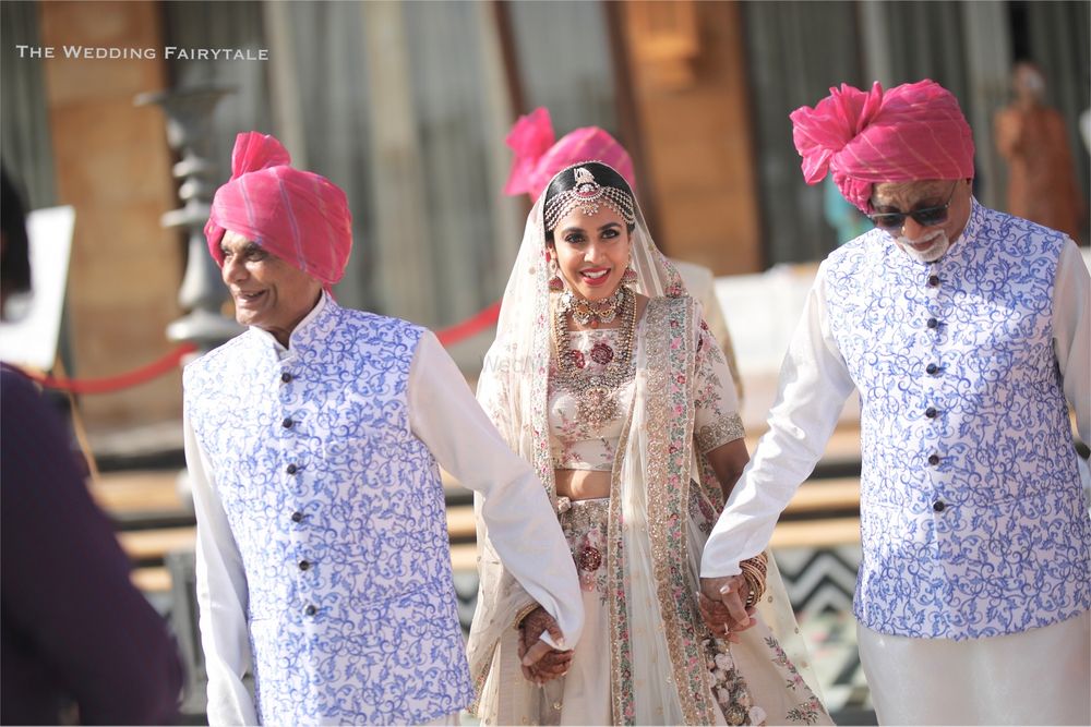 Photo of Bride entering with matching bridesmen