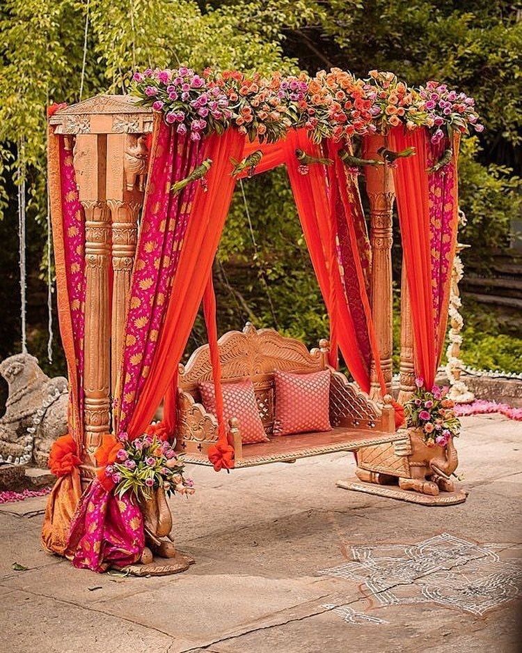 Photo of A beautiful floral arrangement idea for your swing perfect for your mehendi function.
