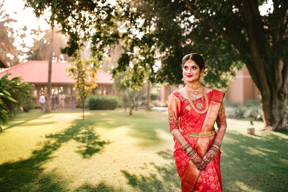 Photo of south indian bride in a gold and orange kanjeevaram