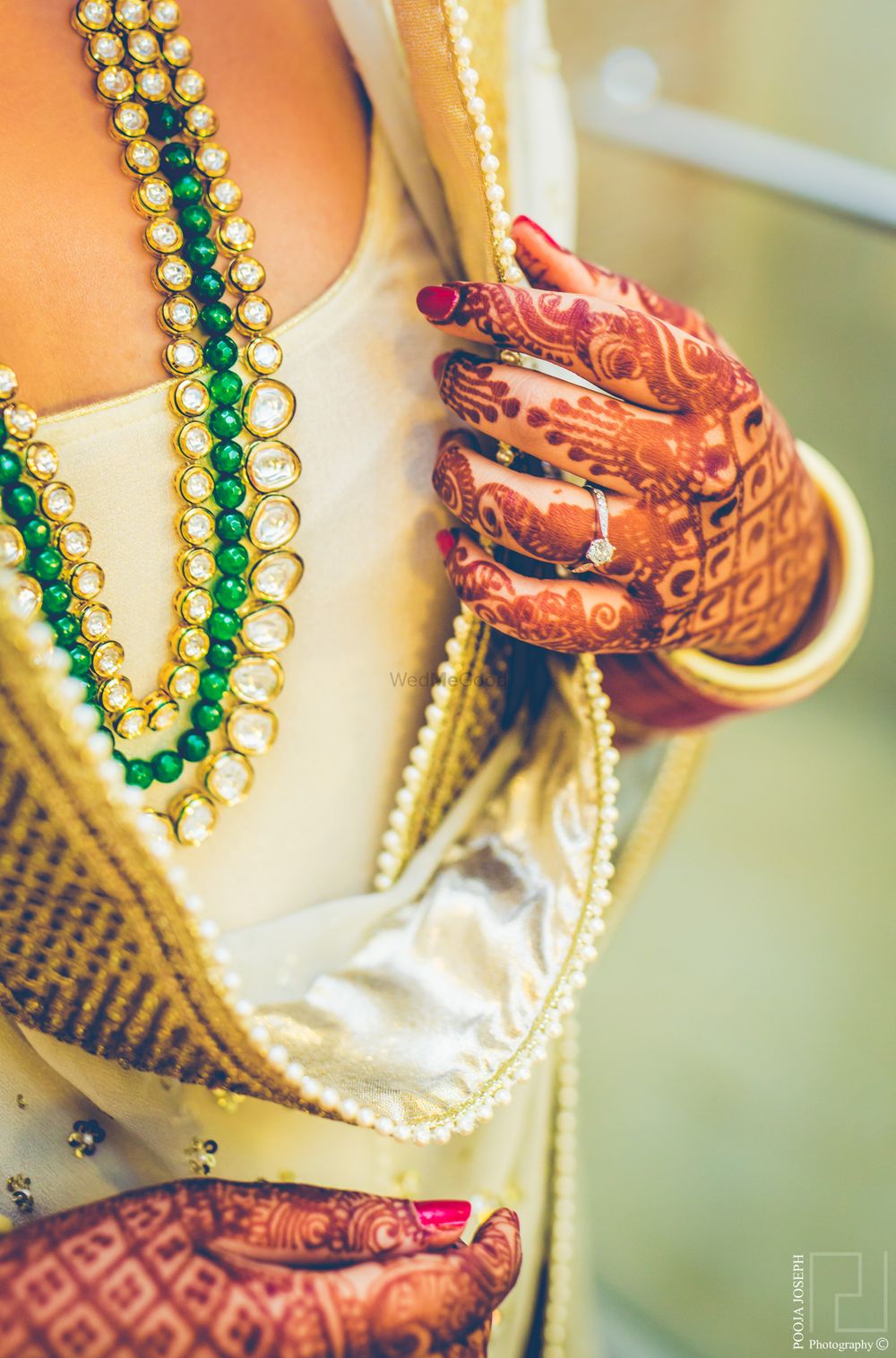 Photo of two strand necklace emerald and polki kundan against cool cream suit