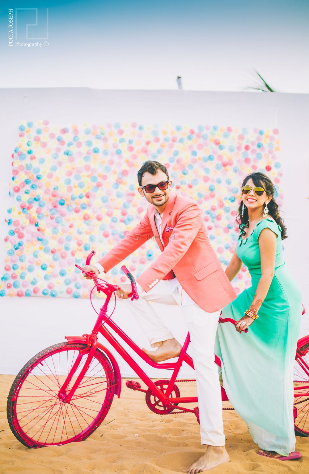 Photo of Colourful Pre Wedding Shoot with Cycle and Balloon Wall