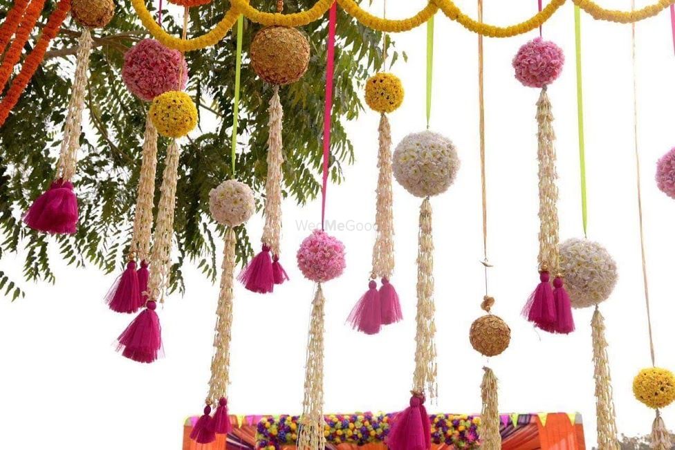 Photo of Pretty hanging floral balls with tassels in mehendi decoration