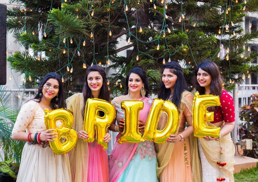 Photo of Bridal squad photo with gold foil balloons