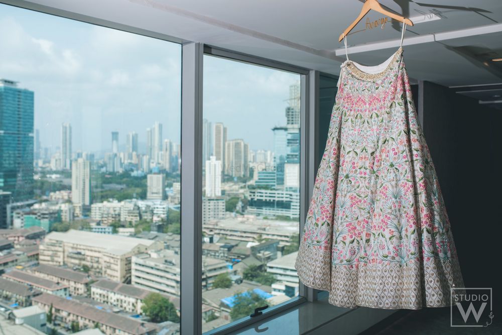 Photo of bridal lehenga on hanger