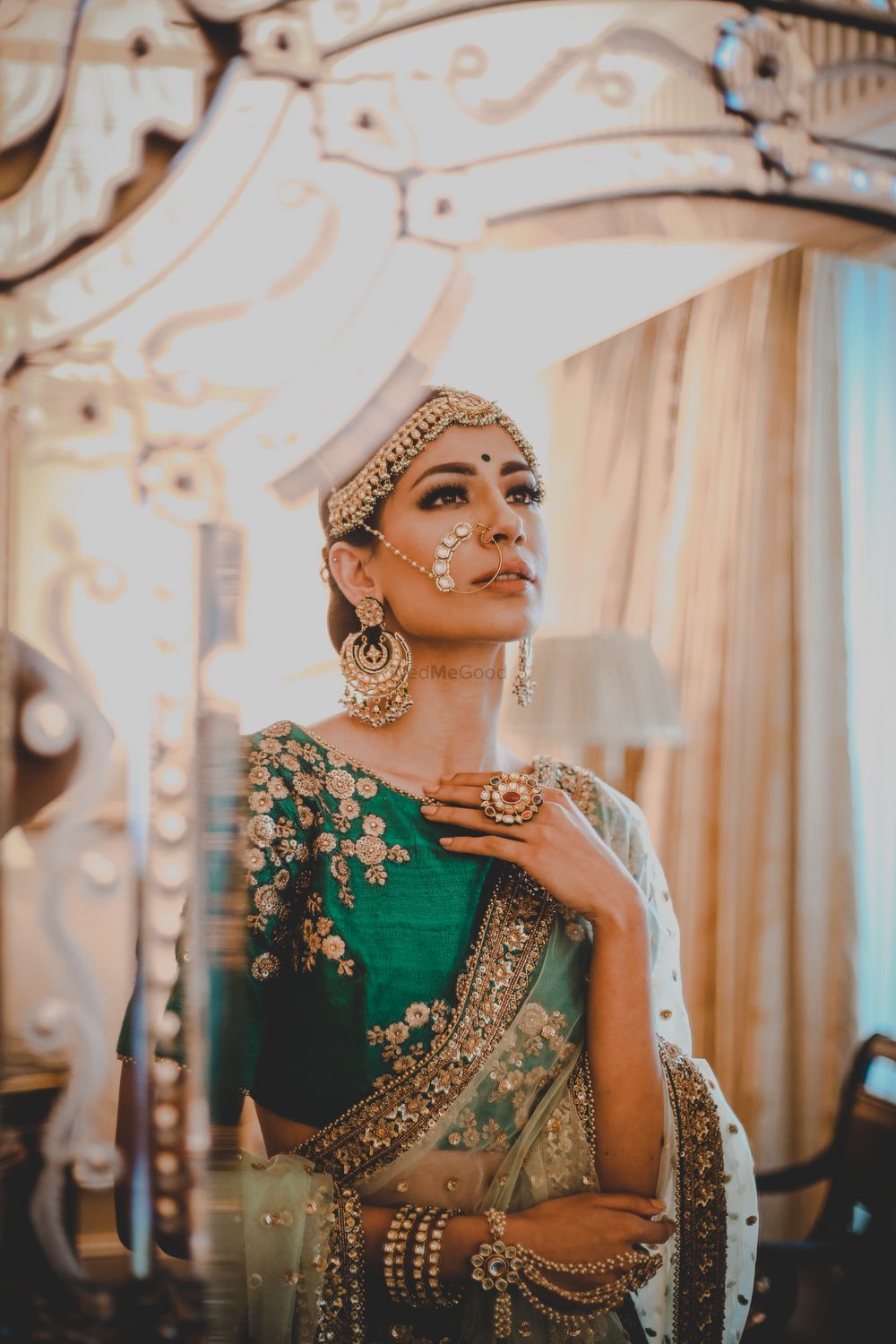 Photo of A bride in gold and green for her wedding