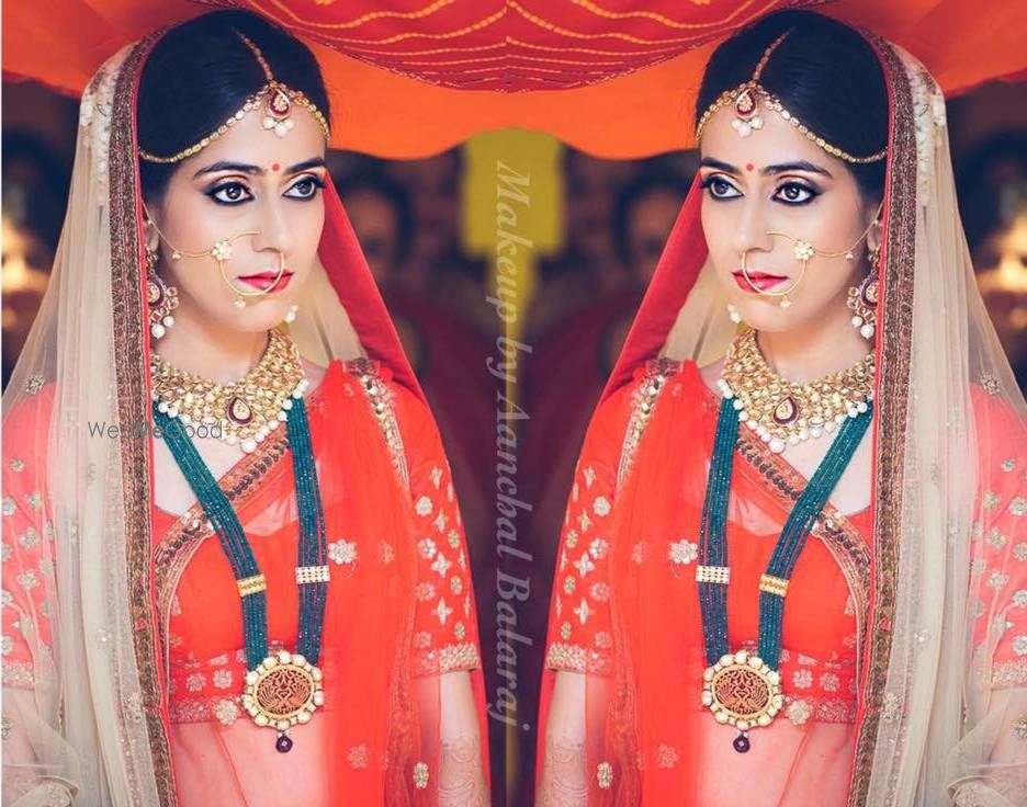 Photo of contrast jewellery with red lehenga