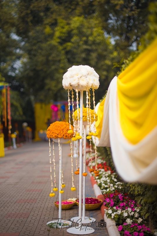 Photo of Entrance decor with marigold bunches on stands