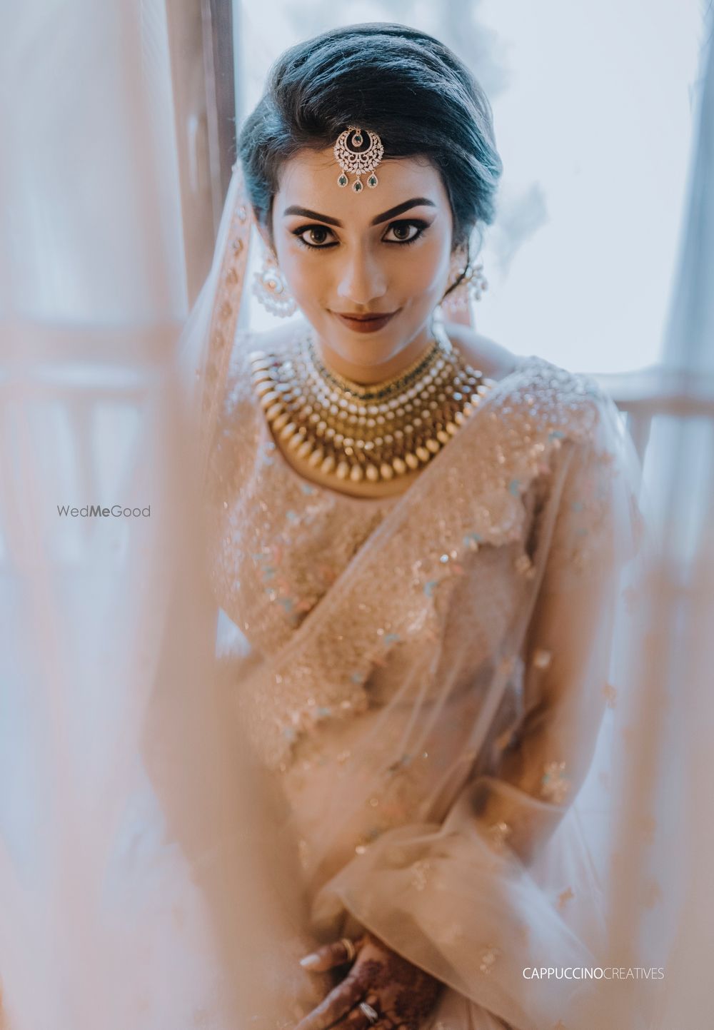 Photo of Beige lehenga with dark lipstick