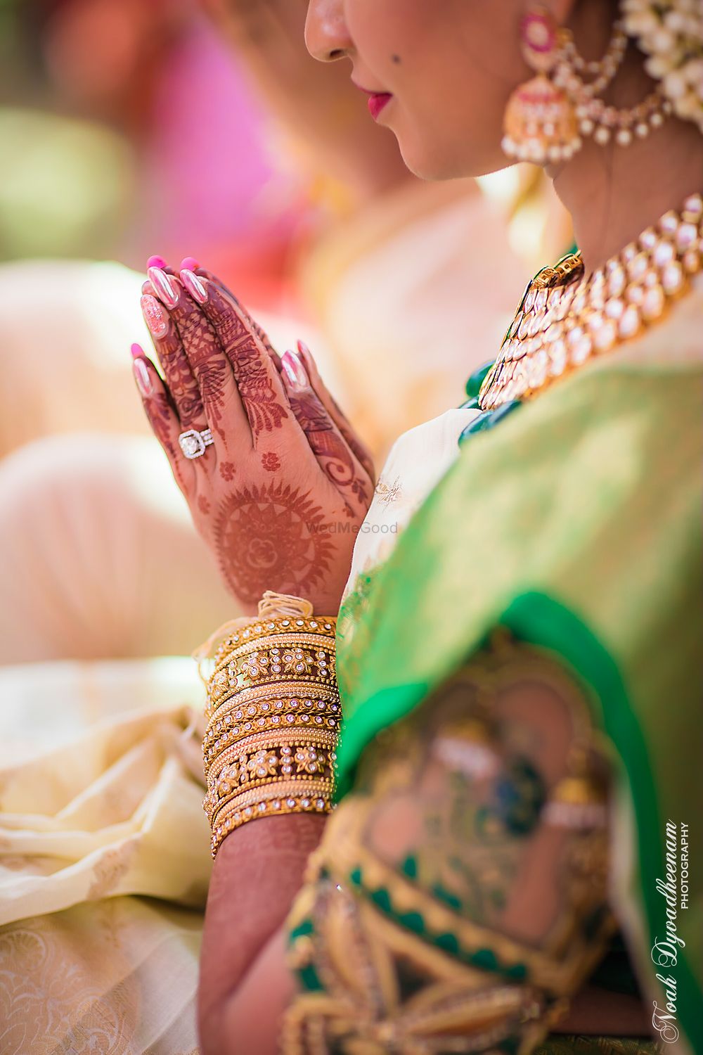 Photo of Bridal hands with mehendi and engagement ring