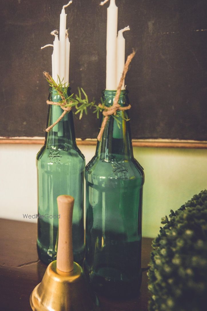 Photo of Green Champagne Bottles as Candle Holders