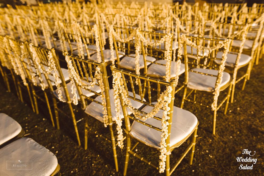 Photo of Elegant floral chair backs in white and yellow theme