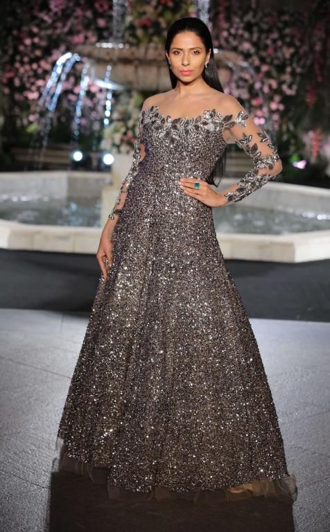 Photo of Dark grey sequin gown with sheer sleeves