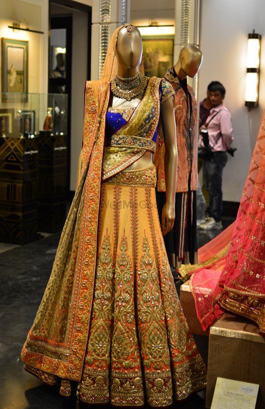 Photo of Tarun tahiliani blue and yellow bridal lehenga