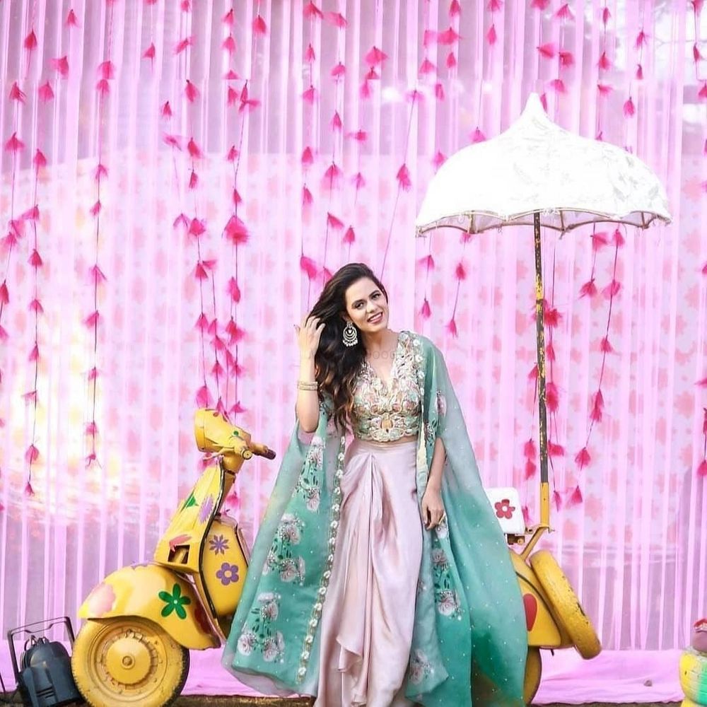 Photo of Mehndi outfit with cape and dhoti skirt