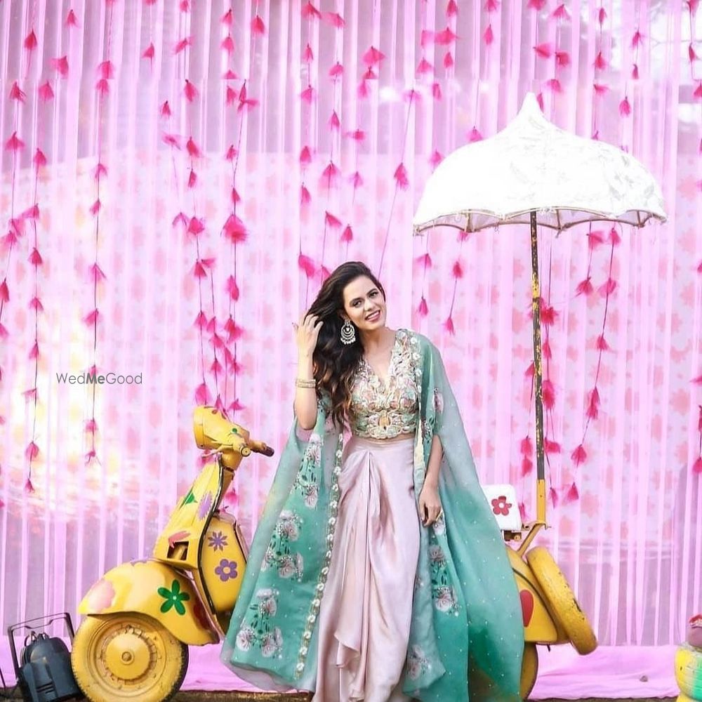 Photo of Mehndi outfit with cape and dhoti skirt